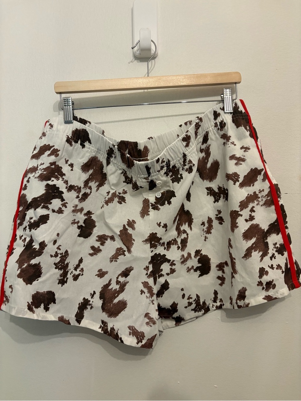 Zoe + Liv White & Brown Cow-Print Athletic Shorts with Red Side Stripe